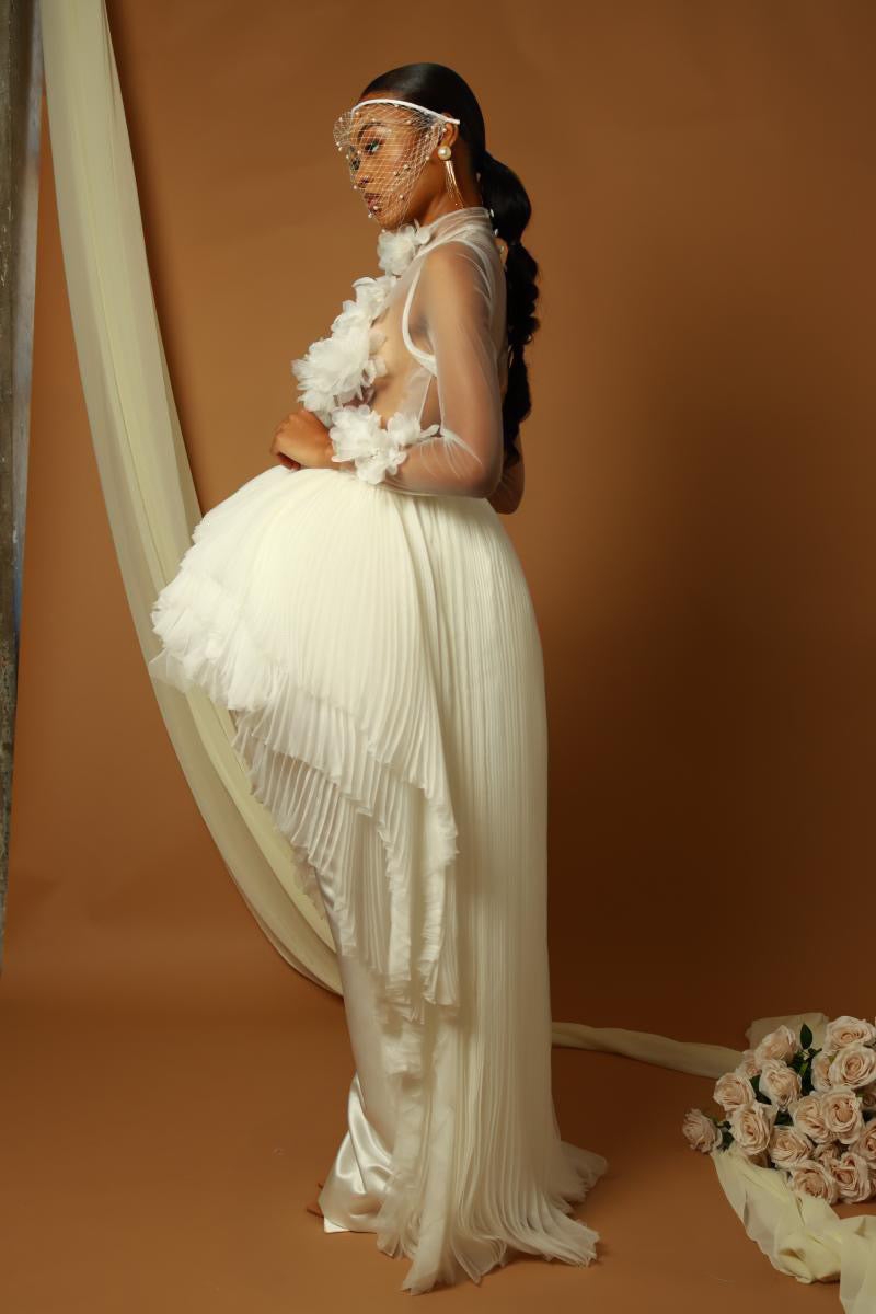 Floral Serenade: Sheer high neck floral bodice wedding dress with pleated chiffon layered peplum with satin column skirt attached. Satin and chiffon gown.